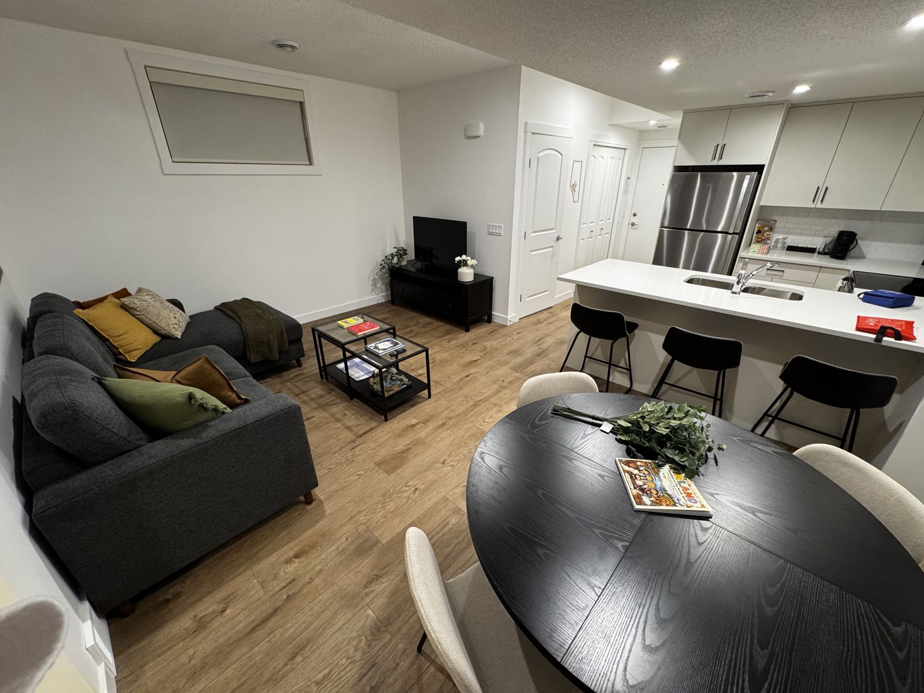Open living room, dining table and kitchen